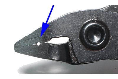 PLIERS WITH STRIPPING FEATURE
